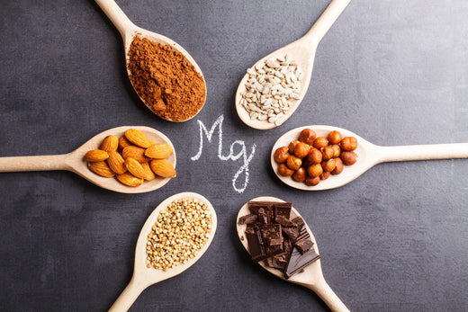 Spoons of magnesium-rich foods on a dark background
