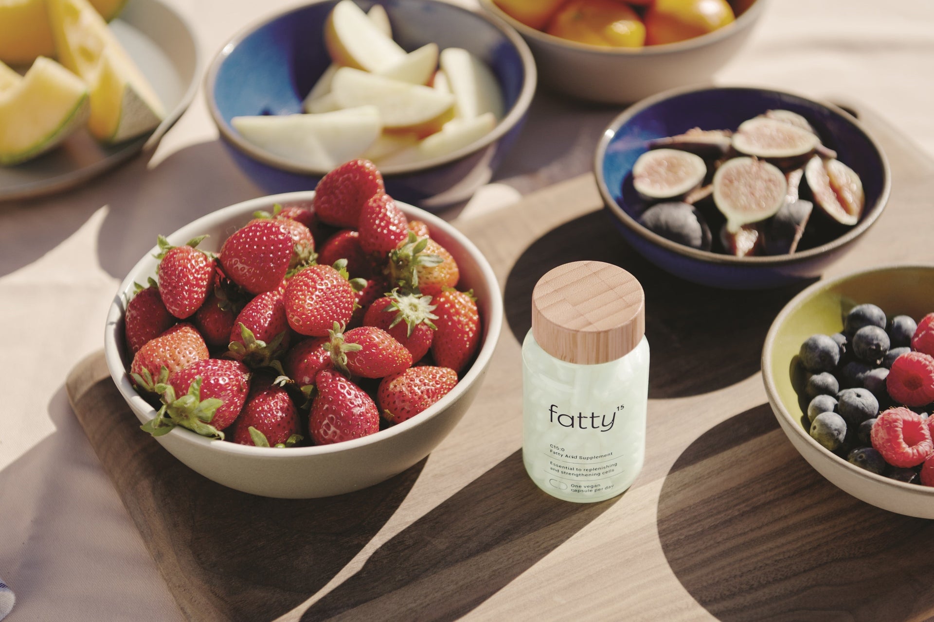 Fatty15's C15 supplement with fresh berries and fruits.