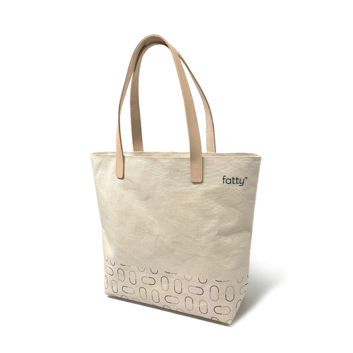 Beige tote bag with Fatty15 logo and abstract pattern.