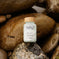 Fatty15's C15 supplement bottle on natural rocks background.