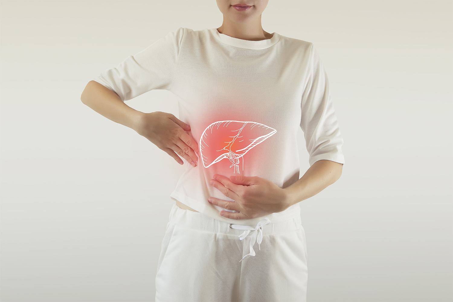 Woman holding liver illustration on abdomen, symbolizing liver health.